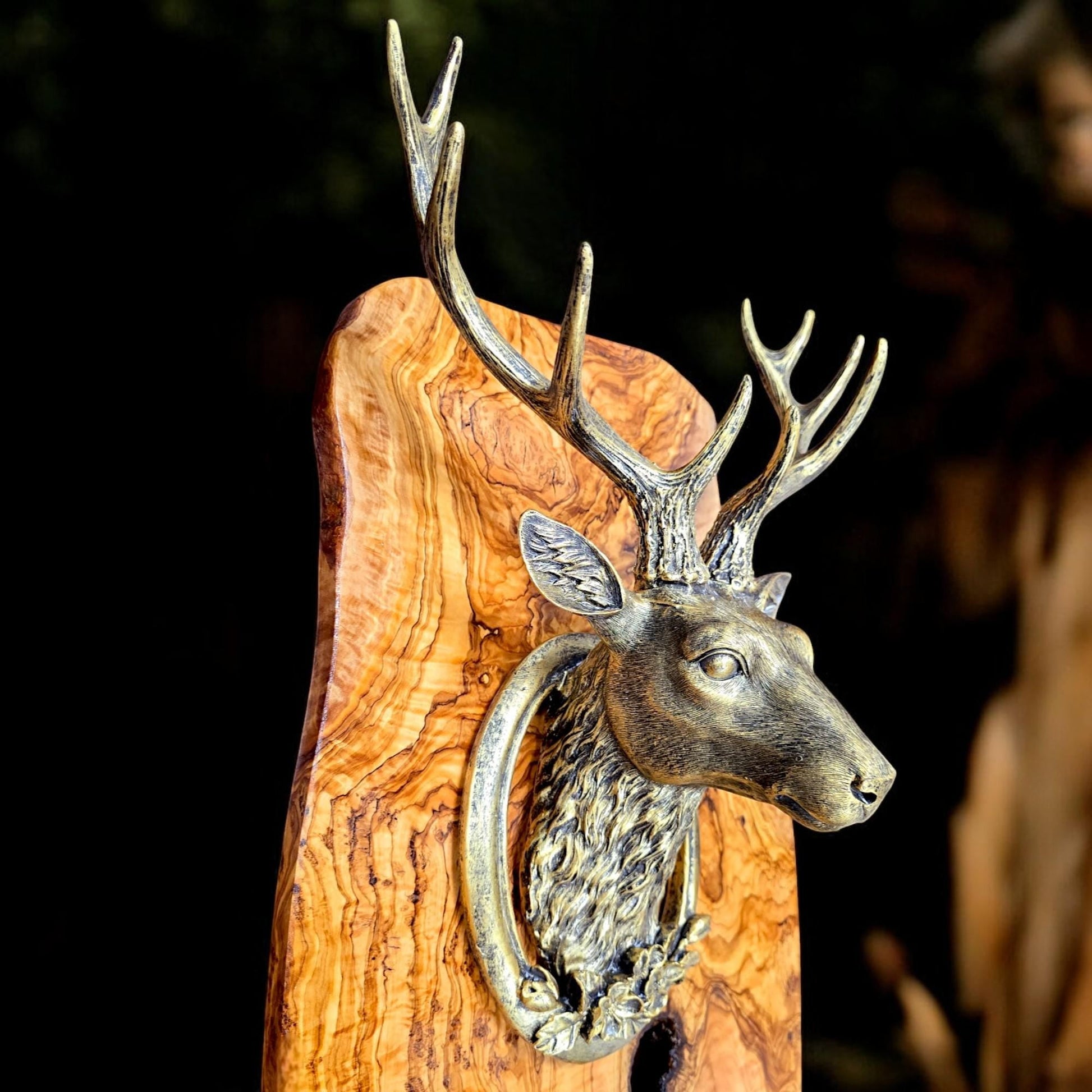 Rustic wall mounted metal stag head with rustic olive wood base