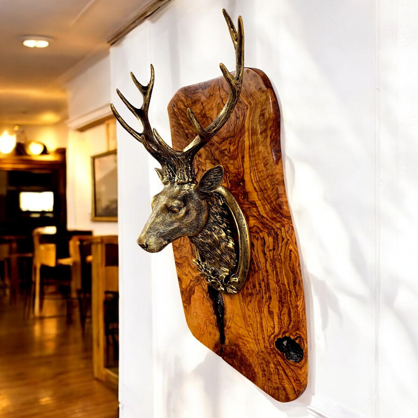 Rustic wall mounted metal stag head with rustic olive wood base